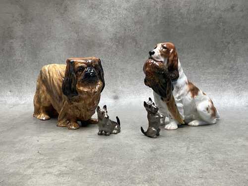 Four Royal Doulton porcelain dog figures, including Springer Spaniel