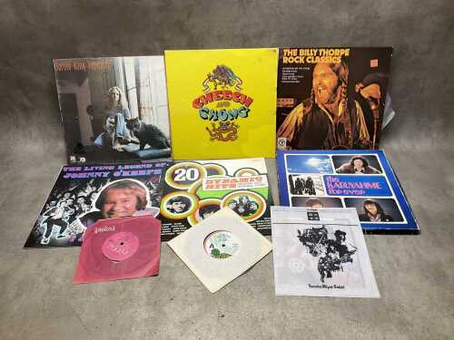 Nine vinyl records, including 7" singles