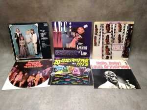 Six vinyl records, including ABBA and ABC