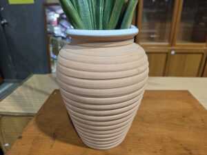 Terracotta ribbed vase displaying vibrant artificial Birds of Paradise blooms - 2