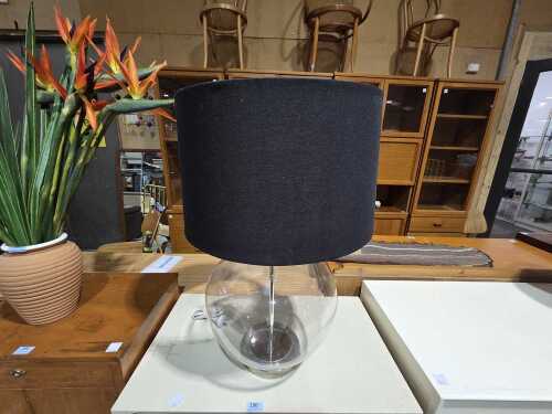 Large clear glass rounded table lamp with black fabric shade