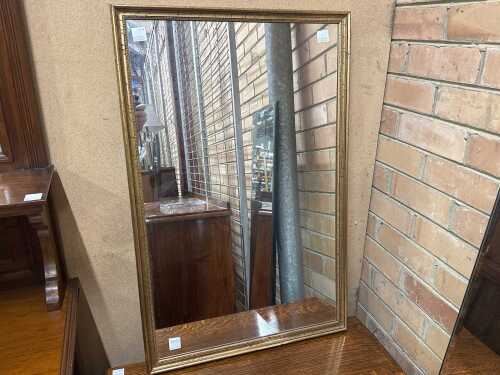 Gilt framed wall mirror