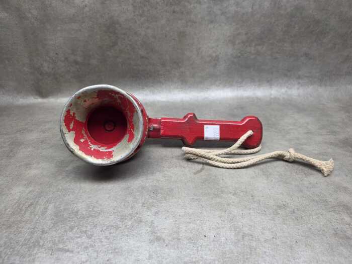 Hand-operated red mechanical siren
