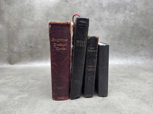 Four antique books, including The New Testament