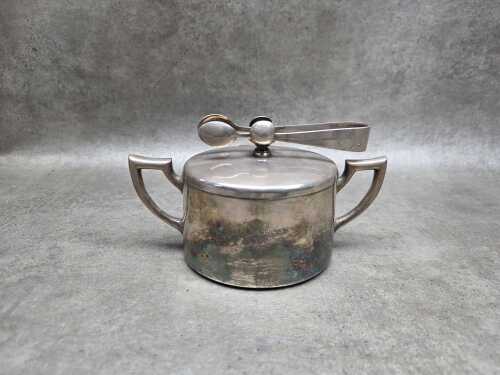 German Art Deco silver plated sugar bowl with attached sugar tongs,