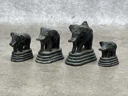 Antique Burmese set of four brass opium weights surmounted by elephant figures