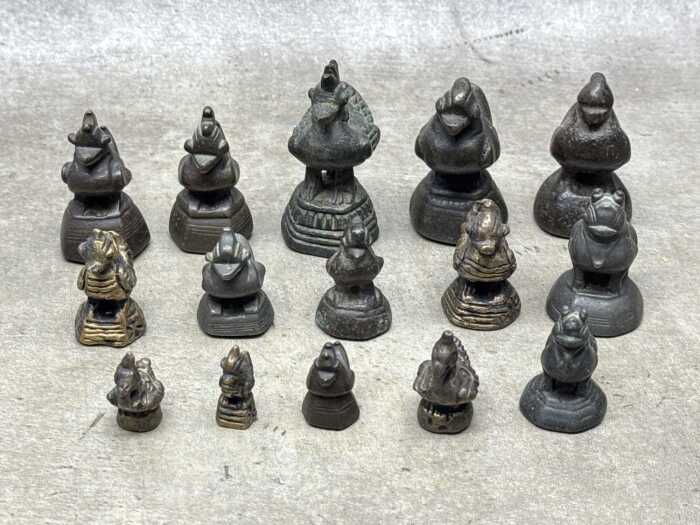 Antique Burmese metal opium weights surmounted by various animal figures