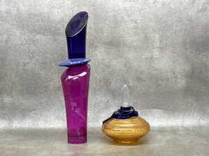 Two perfume glass and plastic store display bottles