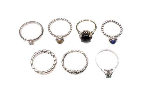A collection of seven rings in sterling silver