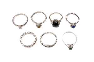 A collection of seven rings in sterling silver