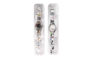 Two Swatch X YOU Skeleton watches in boxes