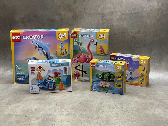 Five LEGO sets, sealed