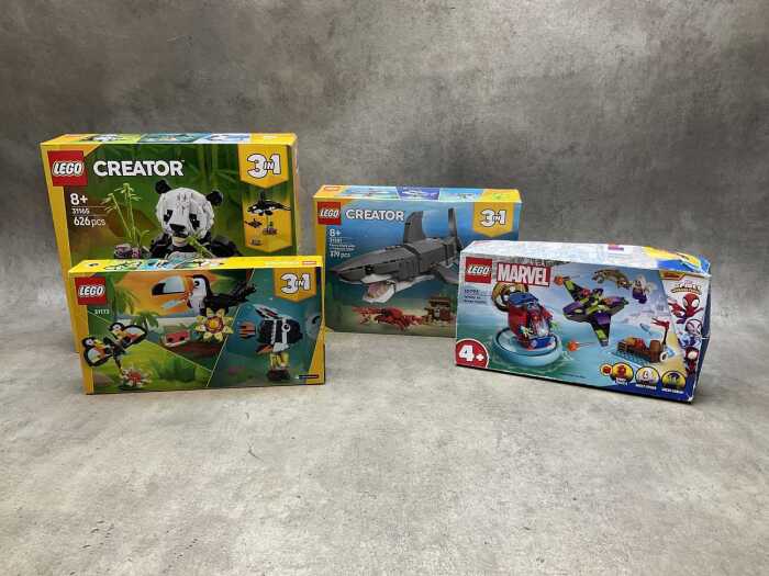 Four LEGO sets, sealed