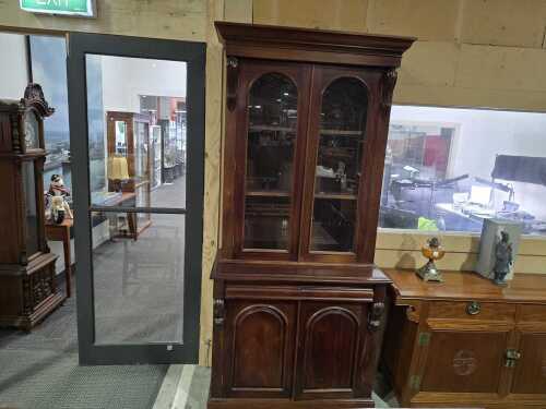 Victorian mahogany two-height bookcase with arched panel doors