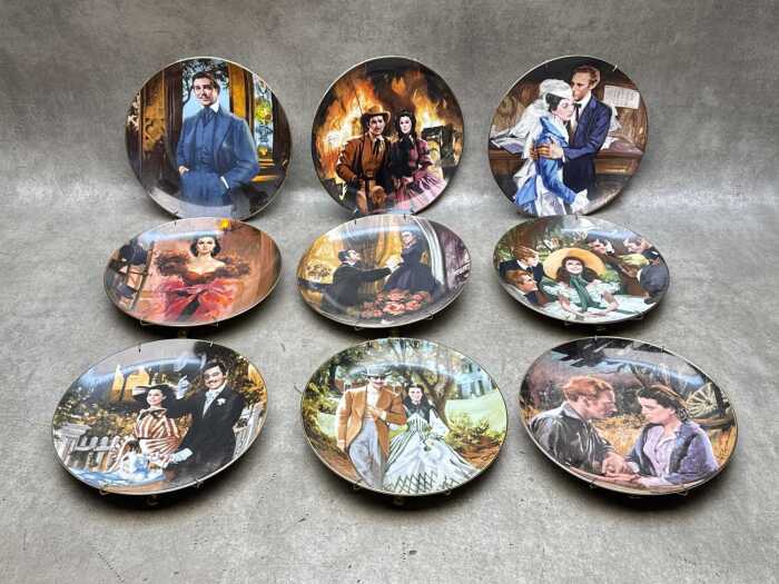 Nine 'Scarlett and Her Suitors' collector plates with wall attachment