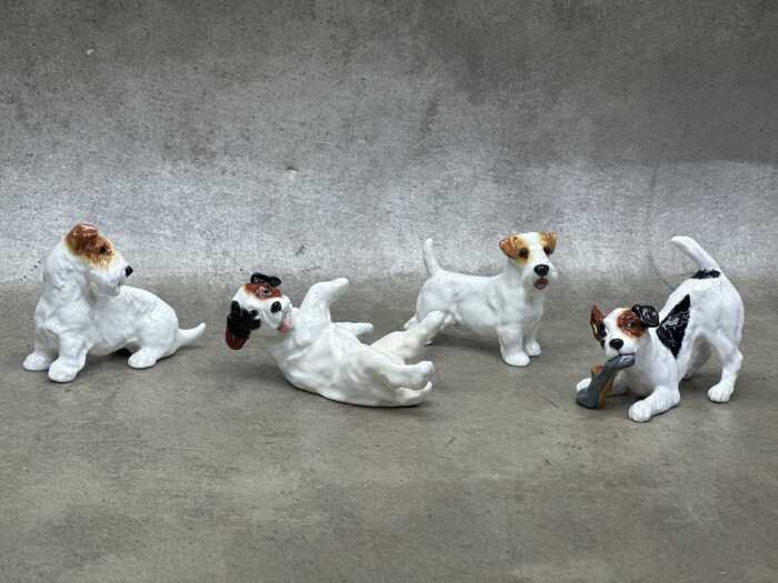 Four Royal Doulton 'Dog of Character' porcelain figures