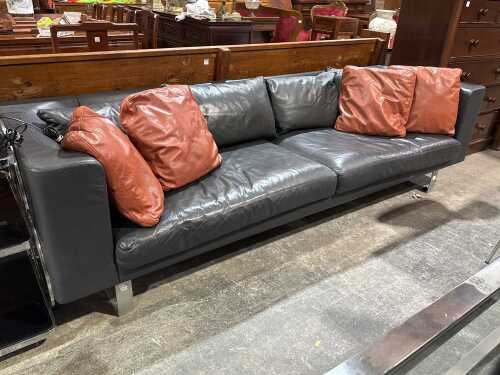 Black leather three-seat sofa on chrome base