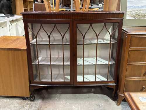 Mahogany bow-front display cabinet with shaped astragal doors
