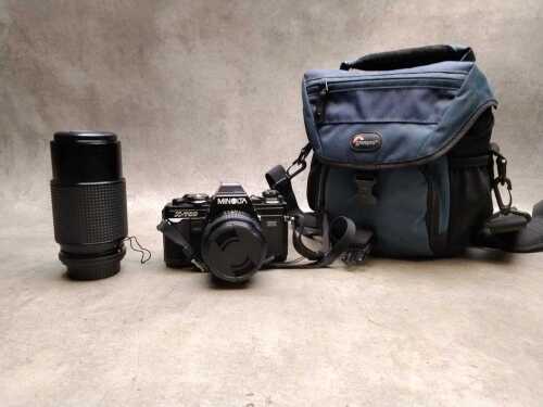 Minolta SLR film camera and Bushnell telescope