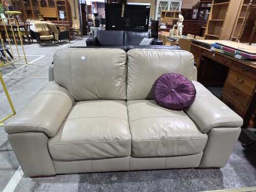 Cream leather two-seater sofa