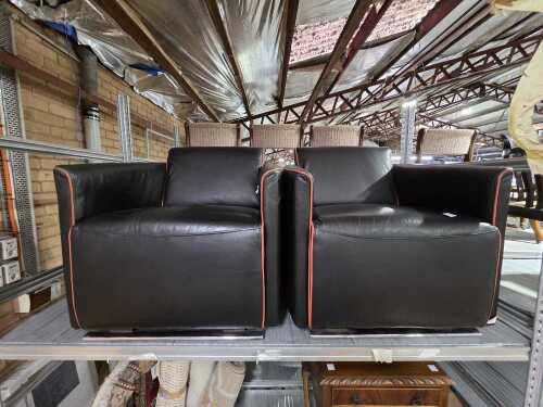Pair of black leather armchairs