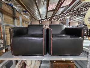 Pair of black leather armchairs