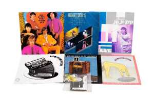 Six Australian Rock vinyl records, together with rock music badges and ephemera