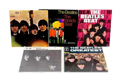 Five Beatles vinyl records on the Odeon label