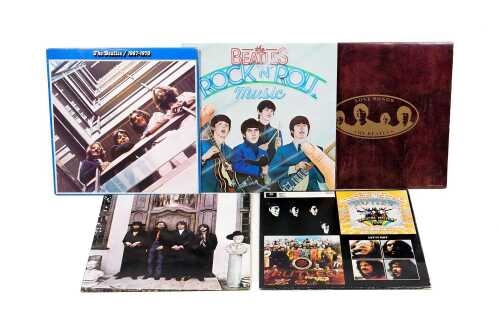 Four Beatles compilation vinyl records, together with The Rutles