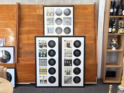 Triptych of fifteen framed Beatles E.P.s from 'The Beatles E.P. Collection'