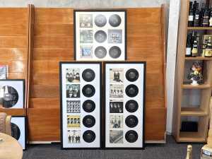 Triptych of fifteen framed Beatles E.P.s from 'The Beatles E.P. Collection'