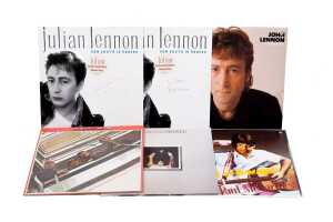 Six Beatles and Family vinyl records, including promos and signed 12" singles