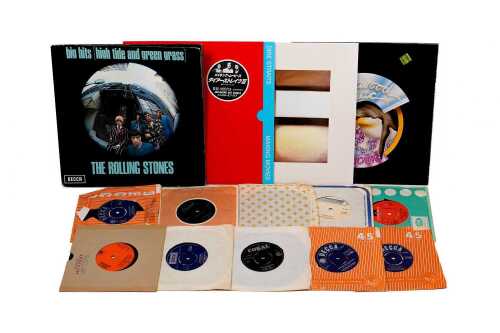 Four Rock LPs, together with a group of 45rpm 7" singles