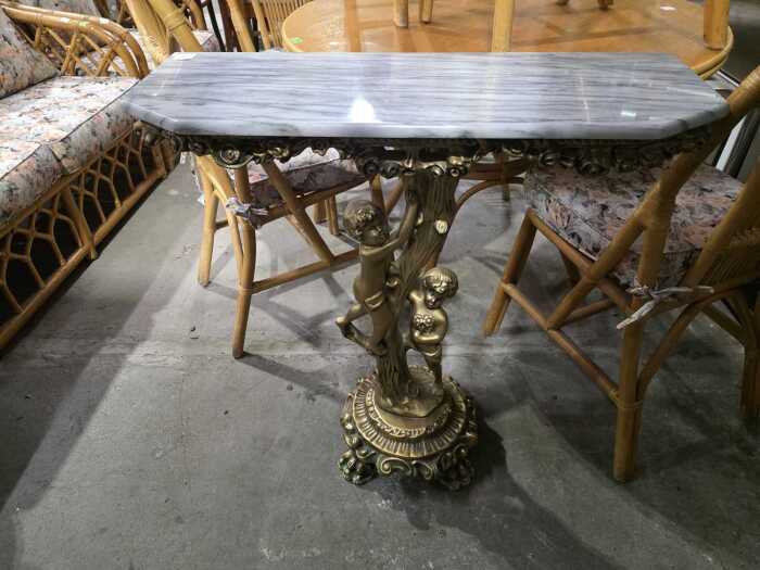 Marble-style console table with figural base