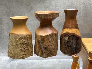Assorted treen including carved Nativity figures in cabinet, turned Mulga wood vases, etc. - 4