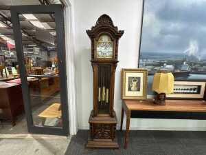 Decoratively carved timber longcase clock