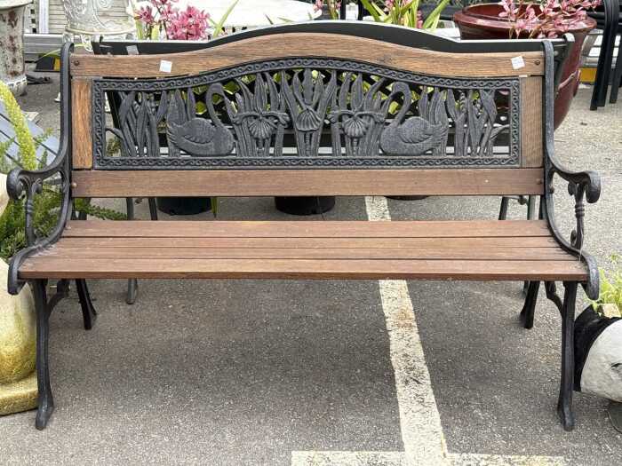 Two-seater timber and cast iron garden bench