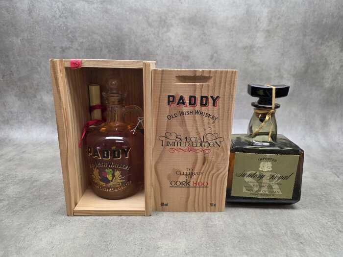 Two bottles of whiskey including Paddy in presentation box and Suntory Royal