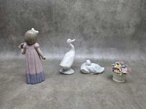 Three Nao by Lladro porcelain figures, plus a floral pot - 3