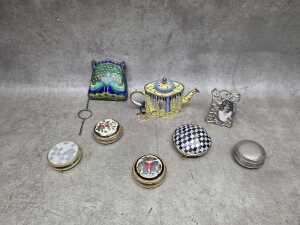Eight metal decorative items, including enamel