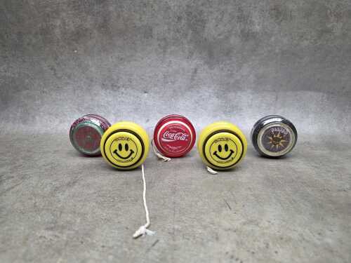 Five vintage Yo-Yos including a Russell Coca-Cola Professional