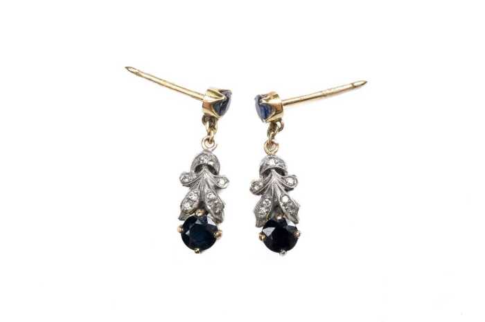 A pair of sapphire and diamond earrings in 9 carat yellow gold