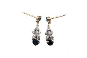A pair of sapphire and diamond earrings in 9 carat yellow gold