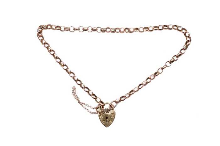 A broken padlock bracelet in 9 carat yellow gold