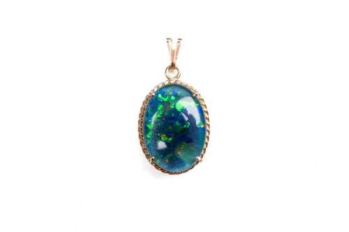 A triplet opal pendant in 14 carat yellow gold