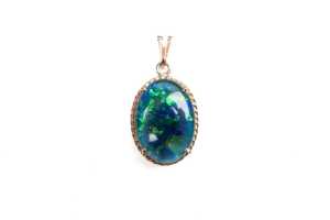 A triplet opal pendant in 14 carat yellow gold