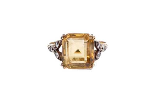 A vintage citrine and white quartz ring in 9 carat yellow gold