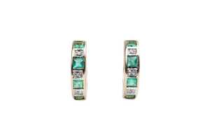 A pair of emerald and diamond hoops in 9 carat yellow gold