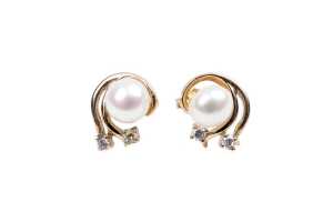 A pair of mabe pearl and cubic zirconia earrings in 9 carat yellow gold