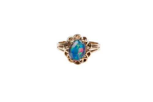 A vintage opal triplet ring in 9 carat yellow gold